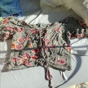 A crop top shirt with strings on the front